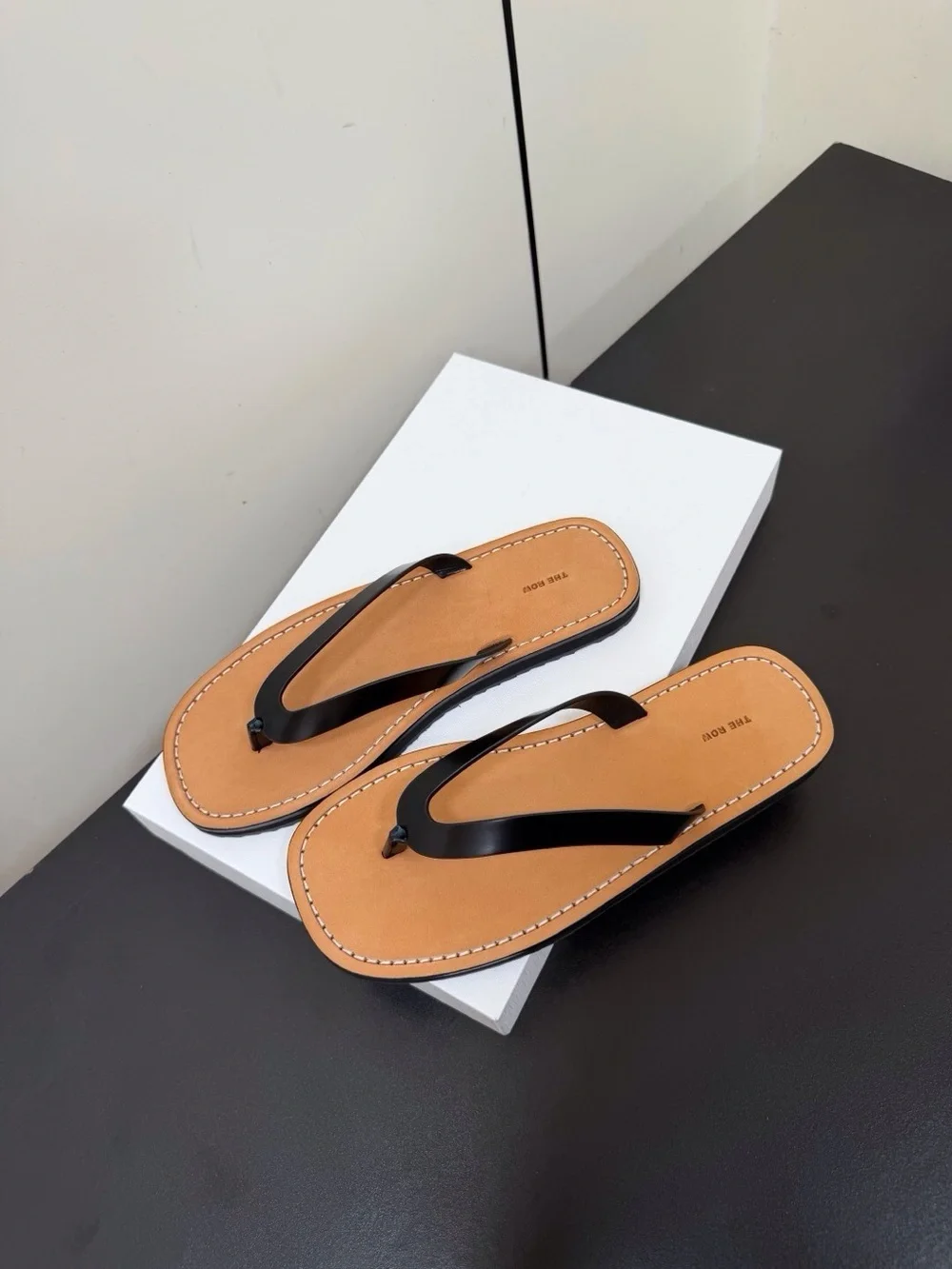 Women’s Tan Leather Flip-Flop Sandals with Black Straps